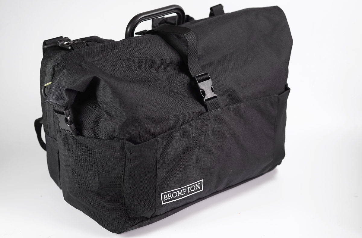 A tiny review of a medium-sized bag for a small folding bike: the Brompton  Roll Top Shoulder Bag | by Ren Willis | Medium